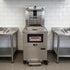 Professional installation of the Tenshine TS-GF5910 commercial auto-lift gas fryer integrated into a stainless steel restaurant kitchen line.