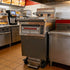 Detailed views of the heavy-duty drain valve, control panel, and heating elements of the commercial electric fryer.