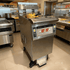 Split vat fryer cooking fish and french fries simultaneously without flavor transfer