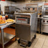 High-efficiency electric open fryer being utilized in high-volume fast food chain operations for consistent results.