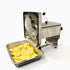 Side profile of the heavy-duty crinkle cut french fry machine showing the output chute and a full tray of freshly cut wavy potato slices.
