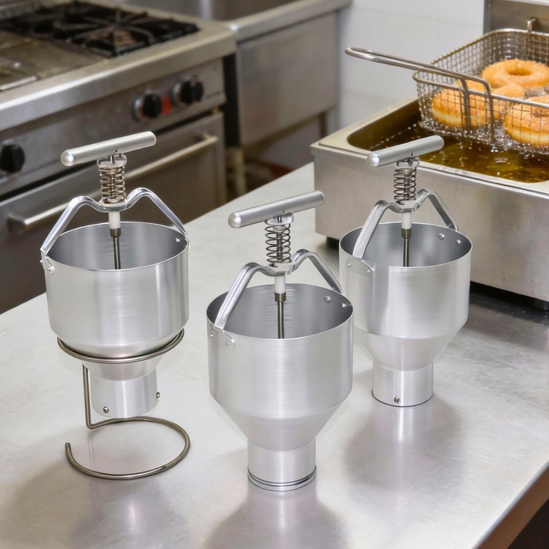 Commercial kitchen setup with manual donut plungers positioned next to a deep fryer