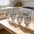 Lineup of four commercial manual donut batter dispensers ready for high-volume production