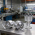 Factory production line of T-3 manual doughnut machines showing aluminum body construction