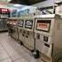 The TS-EF321 restaurant electric fryer installed in a busy commercial kitchen, showcasing its heavy-duty space-saving design.