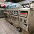The TS-GF321 restaurant deep fryer installed in a high-volume commercial kitchen setting, demonstrating its heavy-duty 304 stainless steel design.