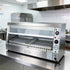 Compact 2-tray commercial heated food display cabinet perfectly positioned on a stainless steel restaurant prep counter.